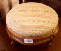 A Victorian Stained Beech Circular Footstool, raised on four cabriole supports and the frame