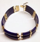 An Oriental Lapis Lazuli and yellow metal mounted Flexible Bracelet of curved double links,