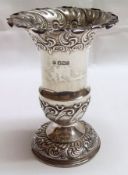 A late Victorian Single Trumpet Vase, of baluster form with flared rim embossed with scrolling