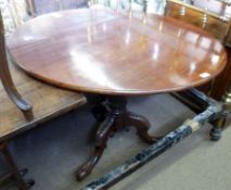 A Mahogany Circular Pedestal Small Dining Table, raised on a fluted and ring-turned column support