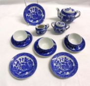 A Willow pattern part Child’s Tea Service, typically decorated in blue and comprises Teapot, two-