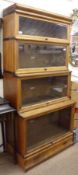 An Oak Globe-Wernicke Bookcase of four graduated glazed sections, all with lifting and sliding