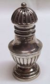 An Edward VII Pepper Caster, with pierced and fluted pull-off cover, half-fluted baluster body on
