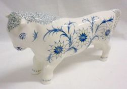 A Wedgwood Model of “Taurus” the bull, decorated in underglaze blue and lemon with stylised floral