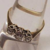 A high grade yellow metal Ring, set with three small old cut Diamonds, stamped “18ct & plat”