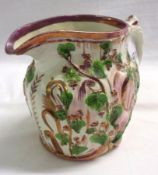 A 19th Century Puce Lustre Pottery Jug, of oval form, embossed with foliage, decorated with green