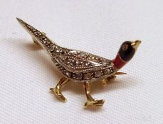 An attractive mid-grade yellow metal Brooch formed as a pheasant, set with small rose cut Diamonds