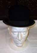 A Gents Black Felt Bowler Hat, silk-lined interior edged with leather sweatband