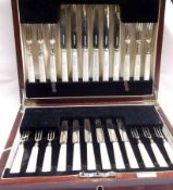 A George VI Mahogany Cased Set of Twelve Each Dessert Knives and Forks, each with polished blades