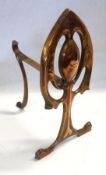 An early 20th Century Cast Andiron of pierced and stylised Art Nouveau form, height 11”
