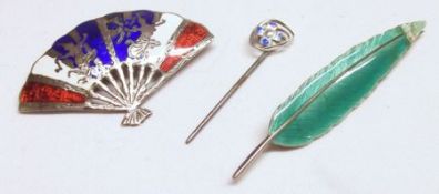 Two white metal and Enamelled Brooches, one formed as a fan, the other as a feather, both with