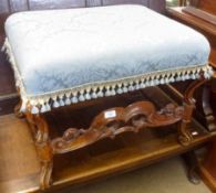 A Walnut Framed Stool of rectangular form, with pale blue floral print upholstered seat, raised on