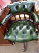 A Reproduction Green Button Back Leather Upholstered Swivel Tub Office Chair, with galleried back