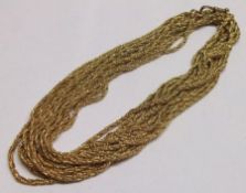 A long gilt metal Triple Strand Rope Twist Guard Chain with snap, approximately 124 cm long