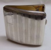A George V Cigarette Case, of hinged rectangular form with engine-turned covers and vacant