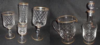 A Suite of 20th Century Stemmed Glasses, all with gilded rims and the bodies geometrically etched