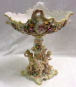A Plaue Centrepiece, the oval top encrusted with flowers and raised on a similarly decorated