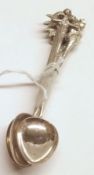 Six white metal Coffee Spoons, each with figural finials on cylindrical stems and polished bowls,