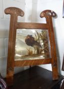 An Oak Arts & Crafts Fire Screen with easel and the two uprights applied with copper foliate mounts,