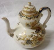 An Oriental Satsuma Teapot of double ground form, the body decorated in red and blue/green, and with