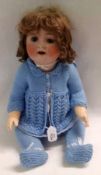 An unmarked German Bisque Head Child Character Doll, grey/blue weighted sleep glass eyes, lashes