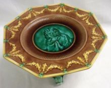 A Wedgwood Majolica Tazza of octagonal form, the centre decorated with head and shoulders of a