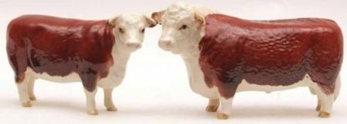 A Beswick Hereford Bull, 1363A (1st version); and a Hereford Cow, 1360, 4 ½” and 4 ¼” high (2)