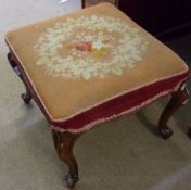 A Rosewood Rectangular Stool with grospoint wood embroidered seat, raised on four cabriole supports,