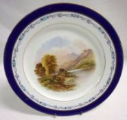 A Coalport Circular Plate, the centre decorated in colours with a titled scene (verso) “Buttermere