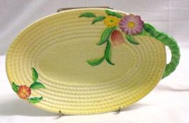 A Carltonware single-handled oval Dish, moulded with foliage on a lemon basket-weave ground, 9 ½”