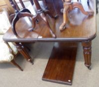 A late Victorian Mahogany Wind-Out Extending Dining Table with moulded edge over a plain frieze,