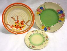Three Clarice Cliff Circular Plates, each decorated with the “Spring Crocus”, “Orange Hydrangea”