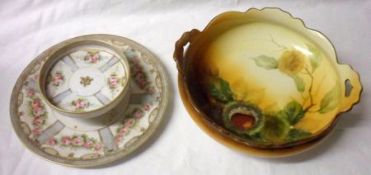 A Noritake circular Two Tier Dish, decorated in colours with floral garlands with pale blue and