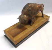 A Patinated and Cast Metal Model of a Bison, mounted on a rectangular wooden base, length 5 ¼”