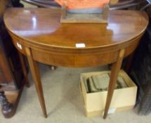 A late 18th Century Mahogany Card Table of demi-lune form, the crossbanded and boxwood strung top