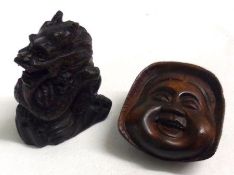 An Oriental Hardwood Netsuke, modelled as the head of a Noh Play Actor; and one other modelled as