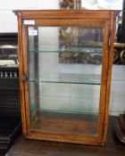 An Oak Table-top Display Cabinet, the top with moulded edge over glazed front, sides and back,