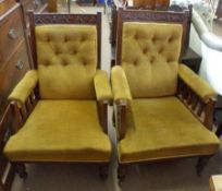 Two late 19th Century Oak Armchairs, upholstered in mustard button back and the splayed arms each