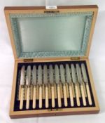 A late 19th Century Mahogany and Box Wood cased Dessert Service for twelve, comprising Knives and