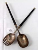 A pair of late 19th Century Serving Spoons, one with cut tines, and both with engraved bowls, ribbed