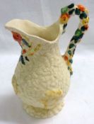 A Clarice Cliff Newport “Celtic Harvest” Ewer, typically decorated, 8 ¾” high