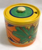 A Clarice Cliff Cylindrical Preserve Pot and Lid, decorated with the “Umbrellas and Rain” pattern,