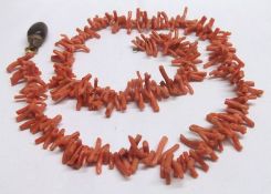 An early 20th Century pink stag Coral Necklace with bean drop, approx. 66cm long