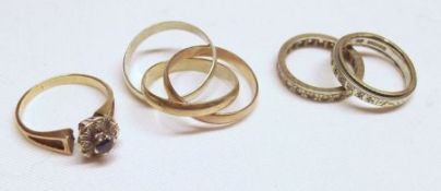 A Packet containing a hallmarked 9ct Gold Russian style three tone interlocking Ring; two Eternity