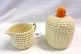 A Clarice Cliff Corn-on-the-Cob moulded Circular Covered Preserve Pot with slotted lid and further