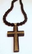 A Victorian Gold Piquet Work Jet Cross, mounted on a carved black bead Necklace