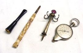 A Mixed Lot comprising: a Rolling Map Rule, Cigarette Holder, Propelling Pencil and part Ring