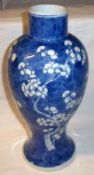 An Oriental Baluster Vase, decorated in underglaze blue with a prunus blossom design (base with 4