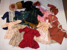 A Trunk containing a quantity of assorted Vintage Dolls Clothes