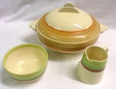 A Clarice Cliff Two-Handled Covered Circular Tureen; and further small Cream Jug and Sugar Bowl,